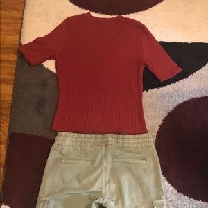 This is a set. Red shirt paired with green pants.